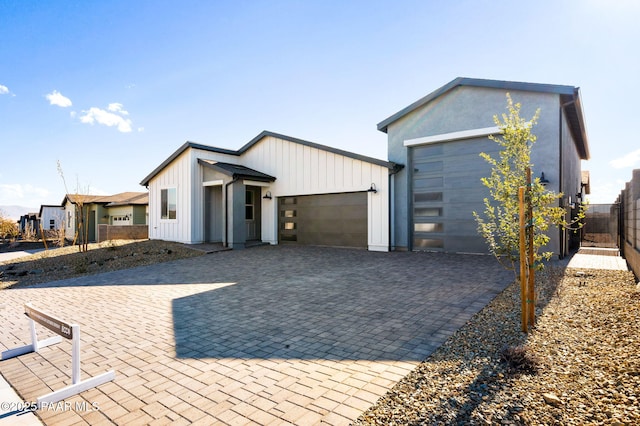 modern farmhouse featuring a garage