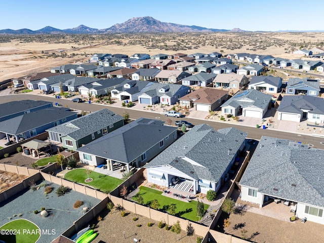 birds eye view of property with a mountain view