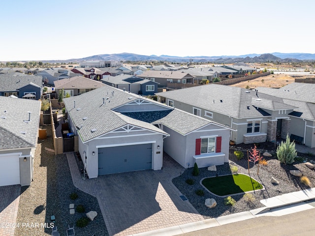 birds eye view of property featuring a mountain view