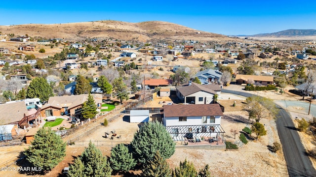 drone / aerial view featuring a residential view and a mountain view