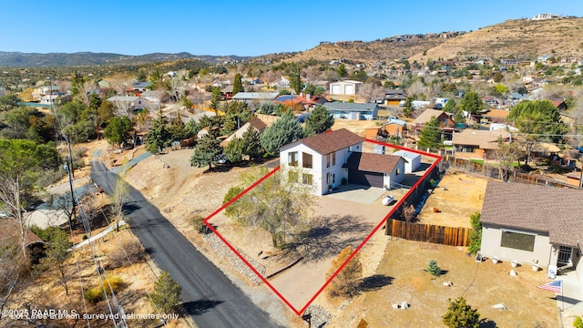 drone / aerial view with a residential view and a mountain view