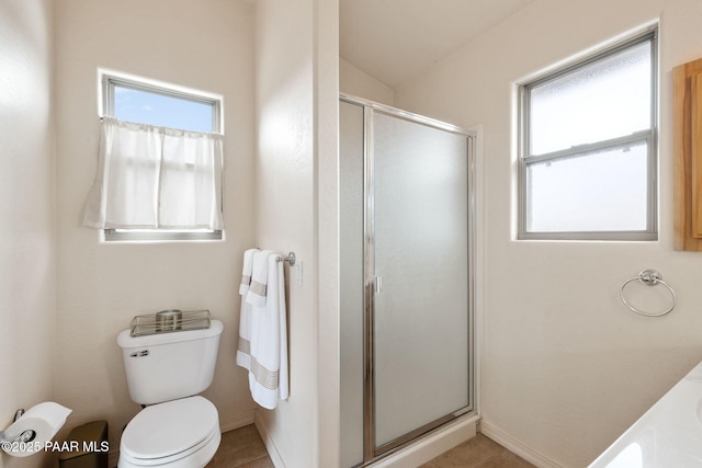 full bath featuring tile patterned floors, a stall shower, and a wealth of natural light