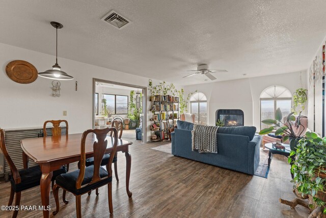 969 S Saguaro Dr, Wickenburg, AZ 85390 - dining space with a ceiling fan, healthy amount of natural light, wood finished floors, and a textured ceiling
