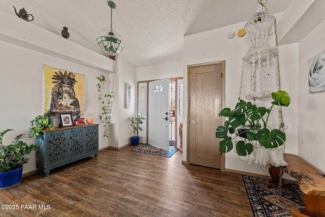 969 S Saguaro Dr, Wickenburg, AZ 85390 - entryway with wood finished floors, a textured ceiling, and baseboards