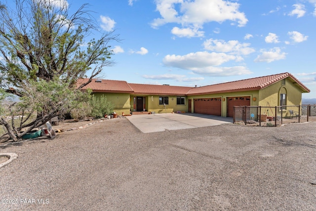 969 S Saguaro Dr, Wickenburg, AZ 85390 - view of front of house with concrete driveway, a tiled roof, stucco siding, and a garage