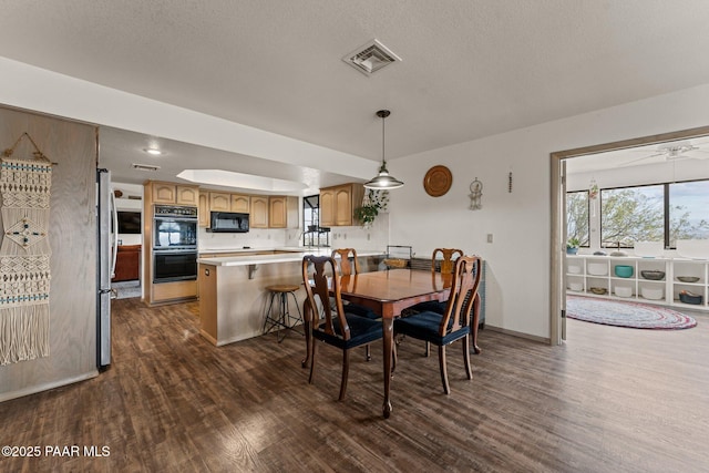 969 S Saguaro Dr, Wickenburg, AZ 85390 - dining room with dark wood-type flooring, baseboards, and a textured ceiling