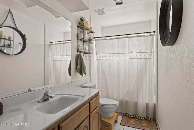 969 S Saguaro Dr, Wickenburg, AZ 85390 - bathroom with toilet, vanity, tile patterned flooring, shower / bath combo, and a textured wall