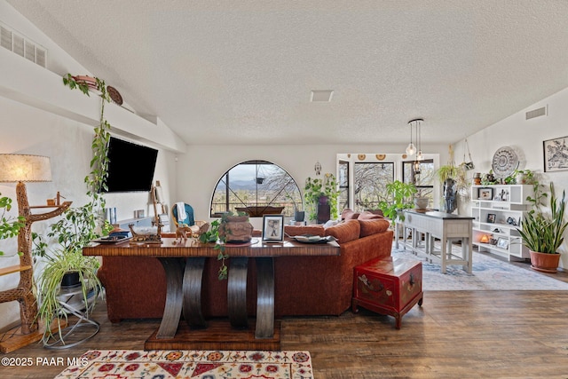 969 S Saguaro Dr, Wickenburg, AZ 85390 - living room featuring wood finished floors, a textured ceiling, and vaulted ceiling