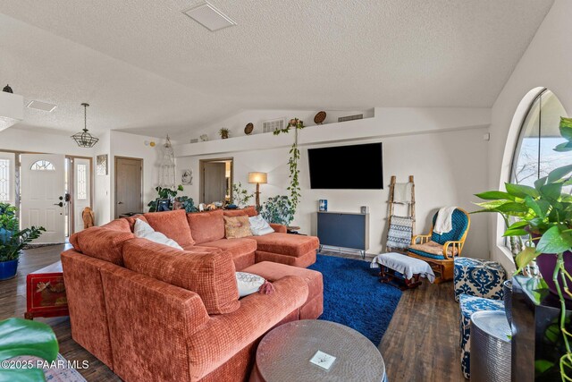 969 S Saguaro Dr, Wickenburg, AZ 85390 - living area with vaulted ceiling, wood finished floors, and a textured ceiling