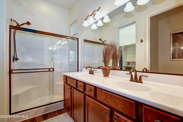 12993 E Toro St, Dewey-Humboldt, AZ 86327 - bathroom with a shower stall, double vanity, wood finished floors, and a spacious closet
