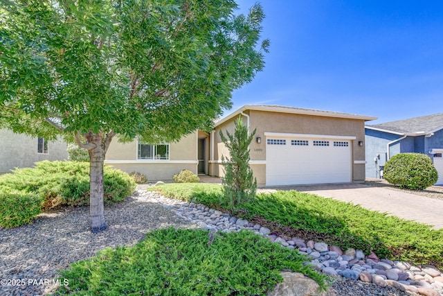 12993 E Toro St, Dewey-Humboldt, AZ 86327 - view of front facade with an attached garage, stucco siding, and driveway