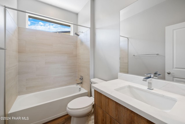 bathroom featuring toilet, shower / bath combination, and vanity