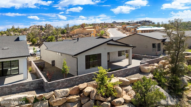 back of house featuring a patio and stucco siding