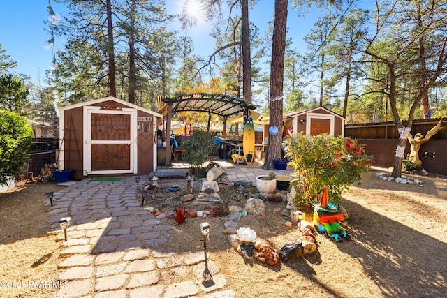 view of yard with a shed and a pergola