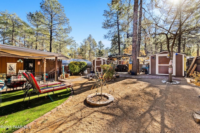 view of yard featuring a playground, a shed, and a trampoline