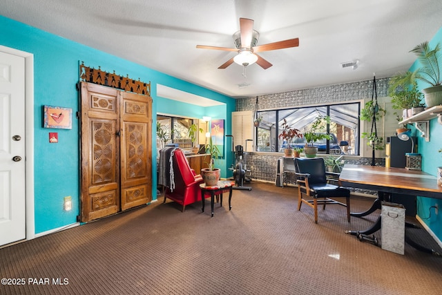 office featuring ceiling fan and carpet