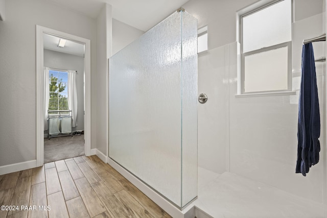 5109 Porter Creek Dr, Prescott, AZ 86301 - bathroom with walk in shower, wood finished floors, and baseboards
