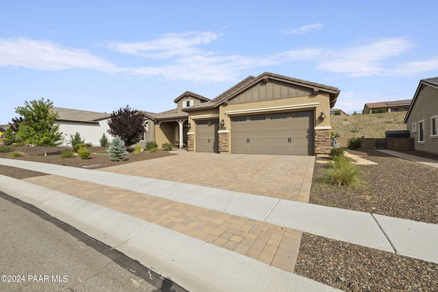 5109 Porter Creek Dr, Prescott, AZ 86301 - craftsman-style home with decorative driveway, a garage, stone siding, board and batten siding, and stucco siding
