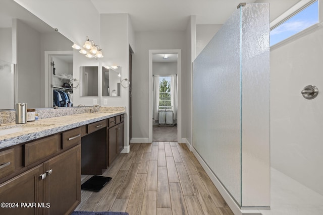 5109 Porter Creek Dr, Prescott, AZ 86301 - full bath featuring a walk in shower, a walk in closet, double vanity, and wood finished floors