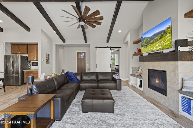 5109 Porter Creek Dr, Prescott, AZ 86301 - living area with light wood-style floors, a barn door, a ceiling fan, beamed ceiling, and recessed lighting