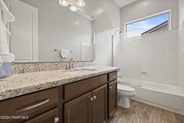 5109 Porter Creek Dr, Prescott, AZ 86301 - bathroom featuring vanity, toilet, wood finished floors, and shower / tub combination