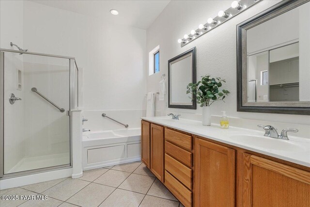 4786 N Edgemont Rd, Prescott Valley, AZ 86314 - bathroom featuring a bath, a shower stall, double vanity, and tile patterned flooring
