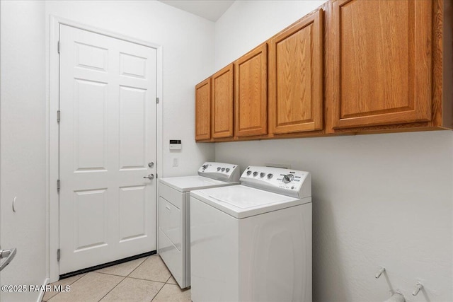 4786 N Edgemont Rd, Prescott Valley, AZ 86314 - washroom with cabinet space, washing machine and clothes dryer, and light tile patterned floors