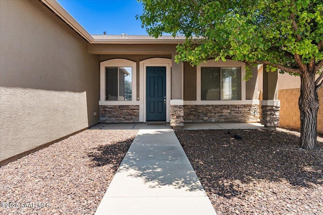 4786 N Edgemont Rd, Prescott Valley, AZ 86314 - doorway to property featuring stucco siding and stone siding
