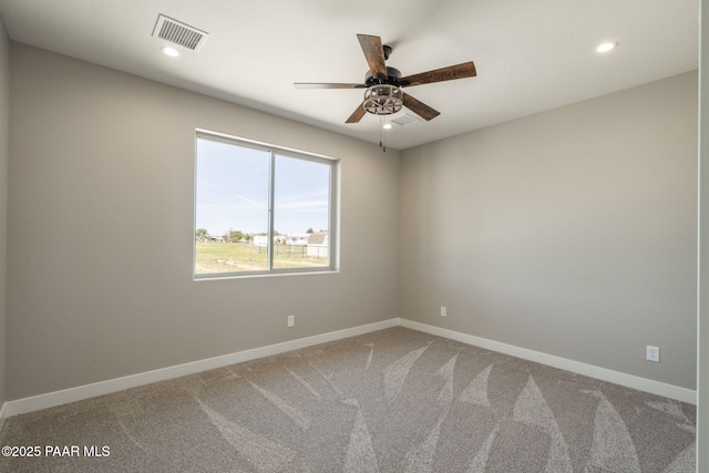 spare room with baseboards, recessed lighting, a ceiling fan, and carpet flooring