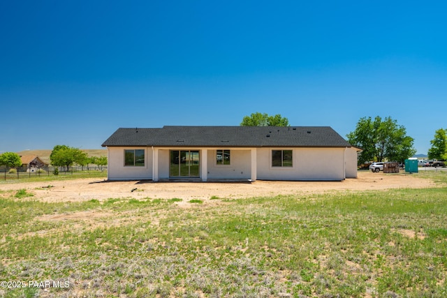 rear view of property with stucco siding