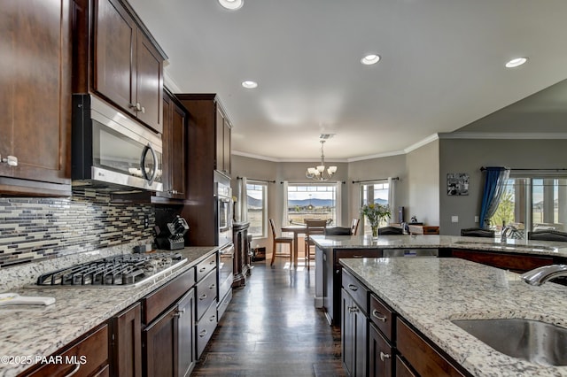 8675 N Buffalo Hill Ct, Prescott Valley, AZ 86315 - kitchen with a sink, plenty of natural light, stainless steel appliances, and a notable chandelier