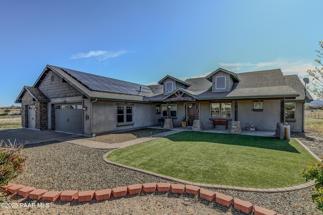 8675 N Buffalo Hill Ct, Prescott Valley, AZ 86315 - view of front of home featuring an attached garage, roof mounted solar panels, stucco siding, and concrete driveway