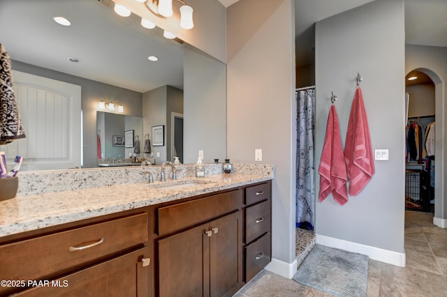 8675 N Buffalo Hill Ct, Prescott Valley, AZ 86315 - bathroom with vanity, curtained shower, baseboards, recessed lighting, and tile patterned floors