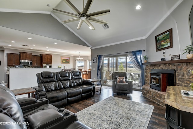 8675 N Buffalo Hill Ct, Prescott Valley, AZ 86315 - living area with visible vents, a wood stove, ornamental molding, dark wood-style floors, and ceiling fan with notable chandelier