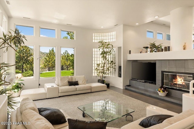 1369 Sierry Peaks Dr, Prescott, AZ 86305 - living area featuring recessed lighting, a fireplace, a high ceiling, and wood finished floors