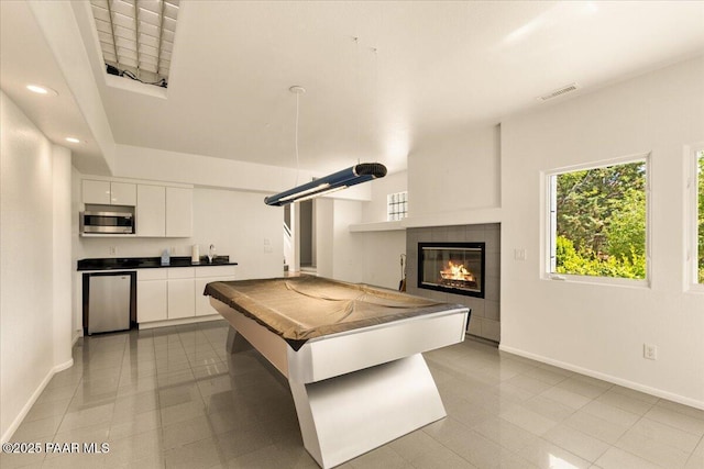 1369 Sierry Peaks Dr, Prescott, AZ 86305 - recreation room featuring a fireplace, healthy amount of natural light, recessed lighting, tile patterned floors, and billiards