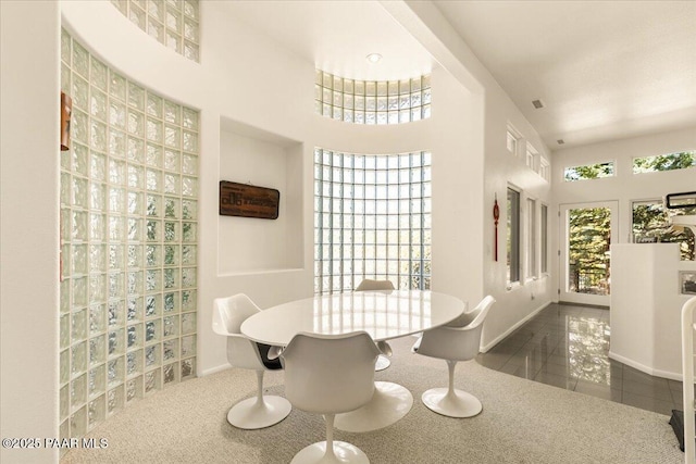 1369 Sierry Peaks Dr, Prescott, AZ 86305 - tiled dining space featuring baseboards and a towering ceiling