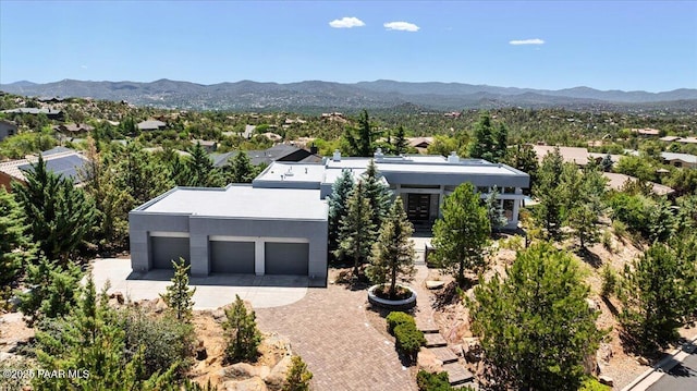 1369 Sierry Peaks Dr, Prescott, AZ 86305 - contemporary home with a garage, decorative driveway, a mountain view, and stucco siding