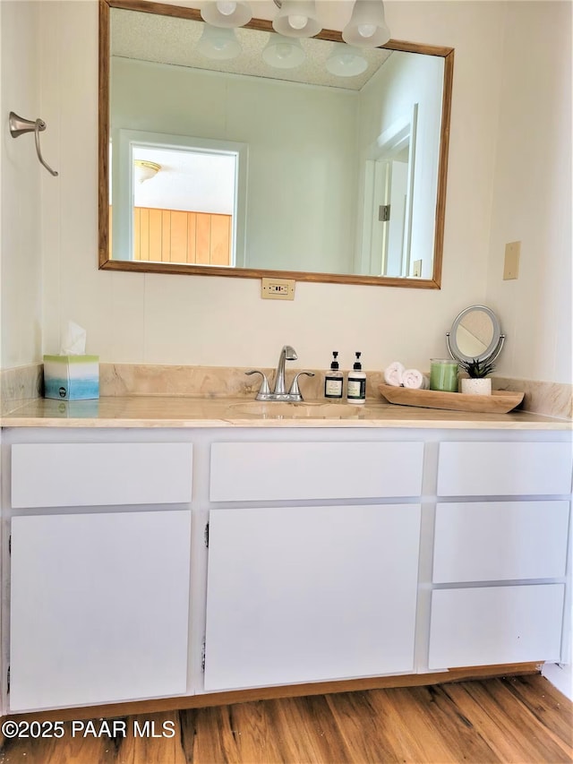 bathroom featuring vanity and wood finished floors