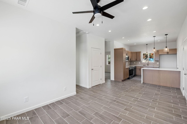 1800 N Pearl Ln, Prescott, AZ 86301 - kitchen with recessed lighting, light countertops, stainless steel appliances, open floor plan, and a ceiling fan