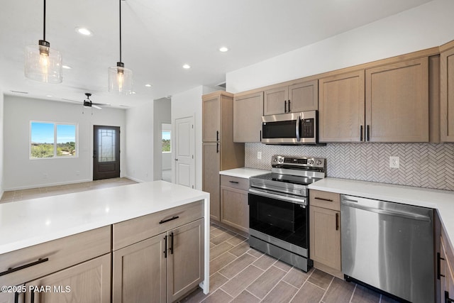 1800 N Pearl Ln, Prescott, AZ 86301 - kitchen with stainless steel appliances, backsplash, light countertops, recessed lighting, and open floor plan