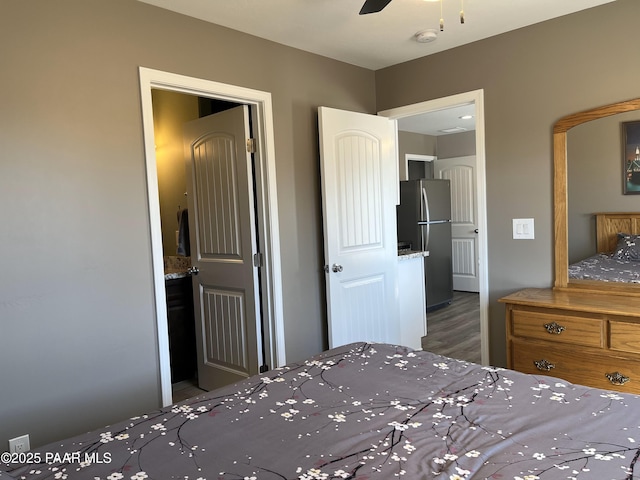 unfurnished bedroom featuring stainless steel fridge