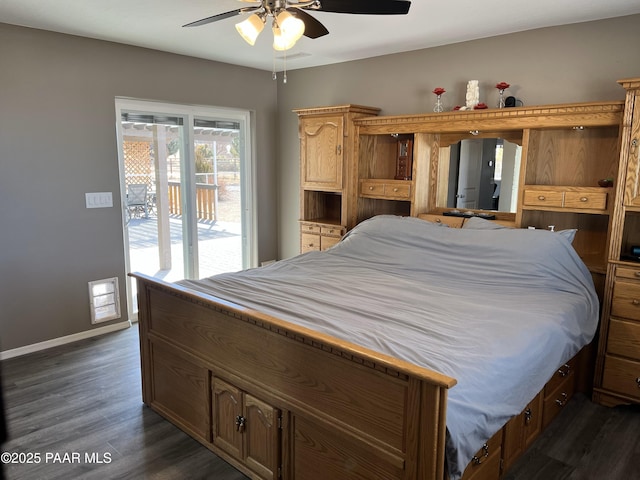 bedroom featuring dark hardwood / wood-style floors, access to exterior, and ceiling fan