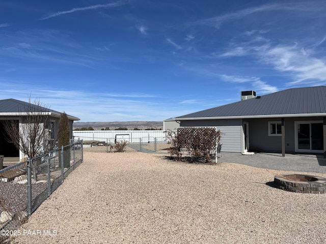 view of yard with an outdoor fire pit and a patio area