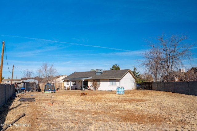 back of property with a trampoline