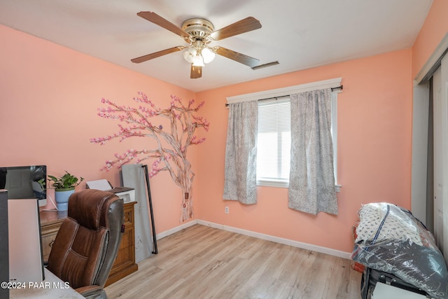 office space featuring ceiling fan and light wood-type flooring