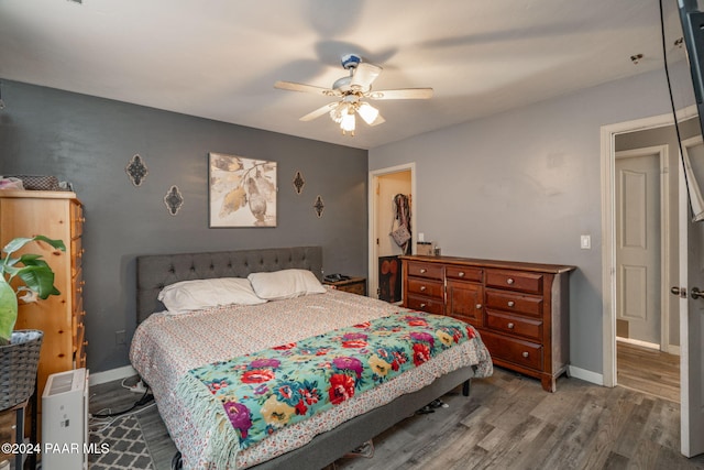 bedroom featuring wood-type flooring and ceiling fan