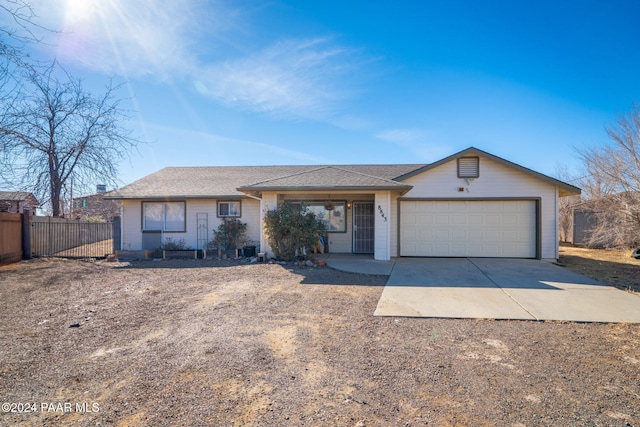 ranch-style house featuring a garage