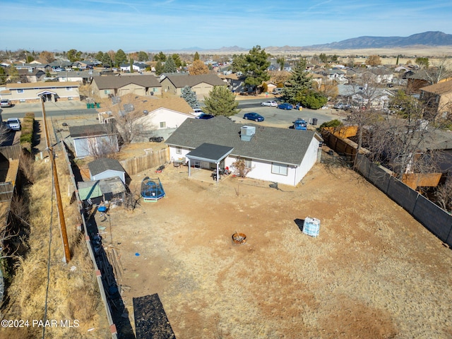 birds eye view of property featuring a mountain view