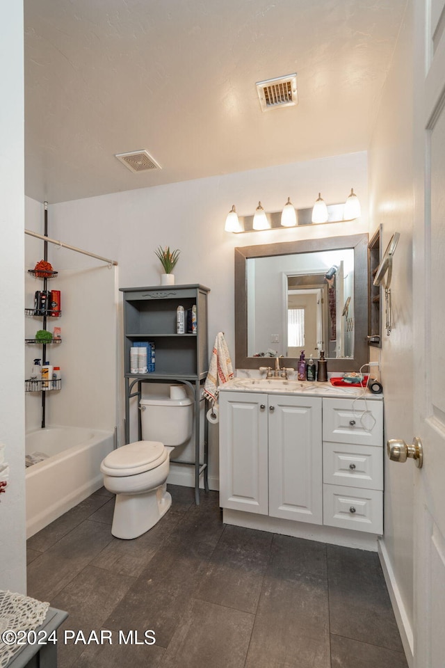 full bathroom featuring vanity, bathing tub / shower combination, and toilet